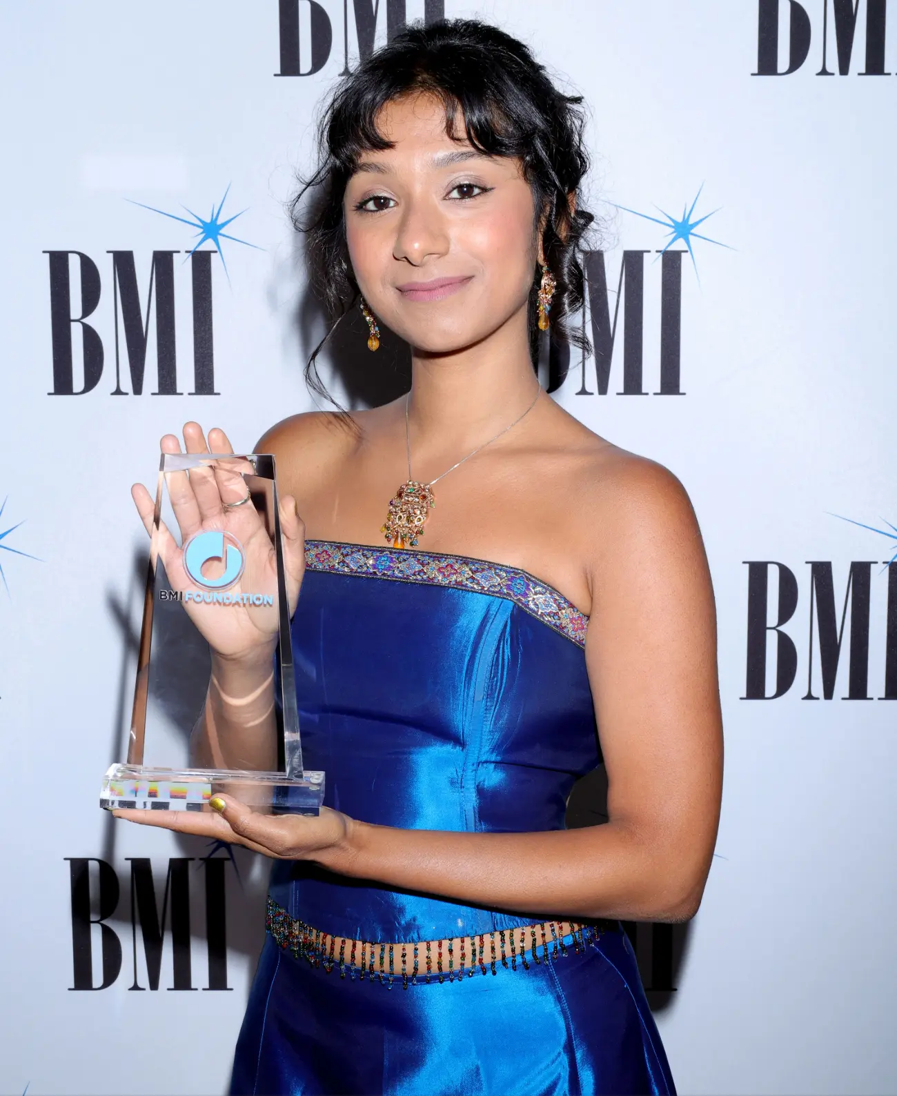 Rijah Banerjee with her inaugural BMI Foundation Babyface Award. (Photo by Lester Cohen