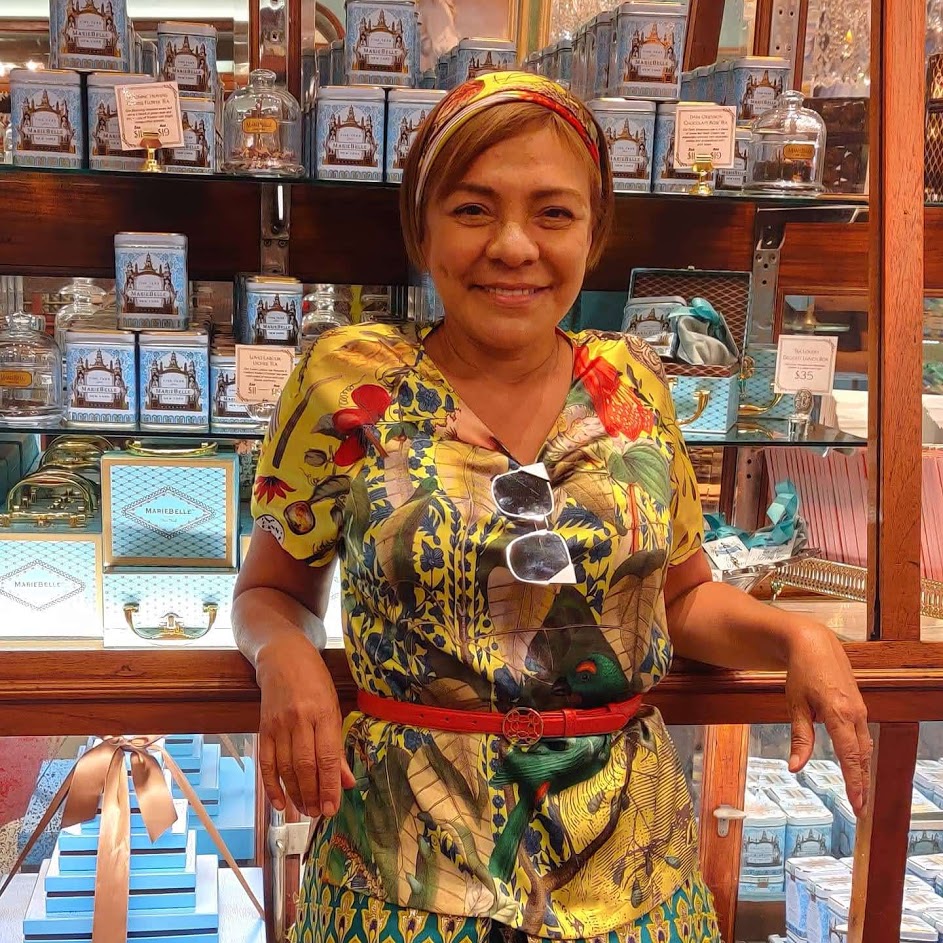Maribel Lieberman in a yellow dress in her store