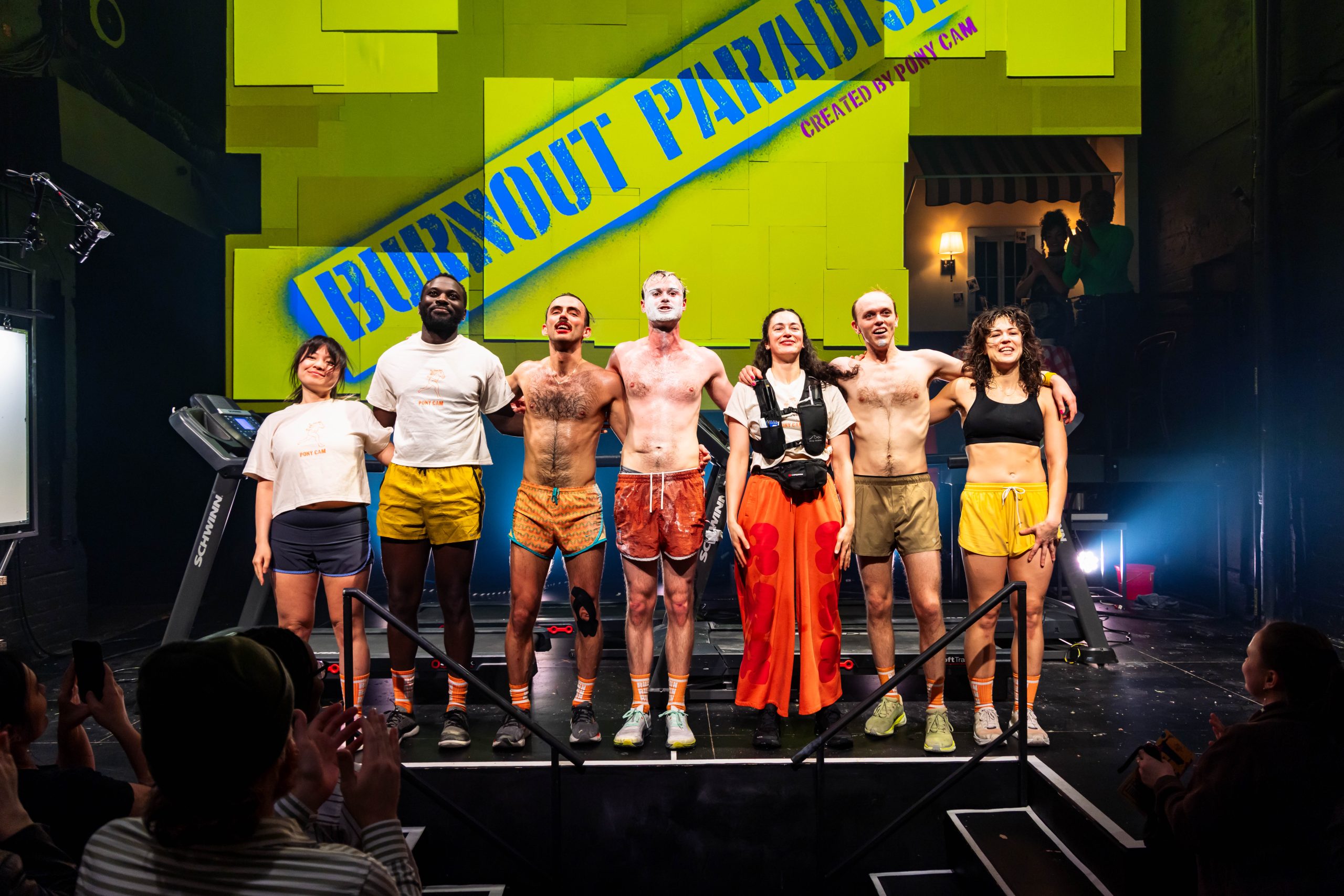The cast of BURNOUT PARADISE taking a bow on stage after their opening night performance.