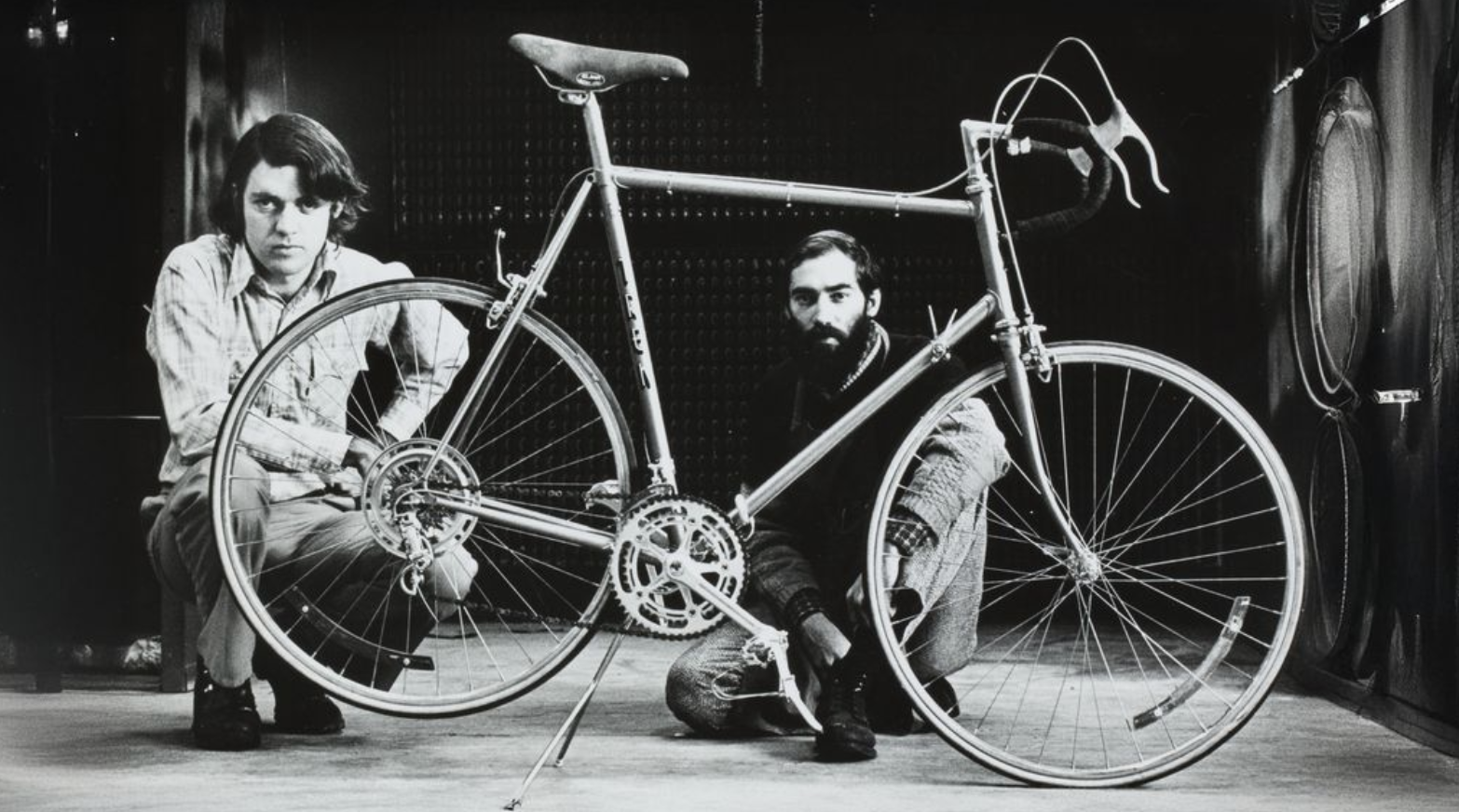 Two men fixing a bike.