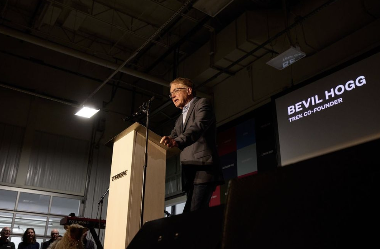 Man standing next to a podium.